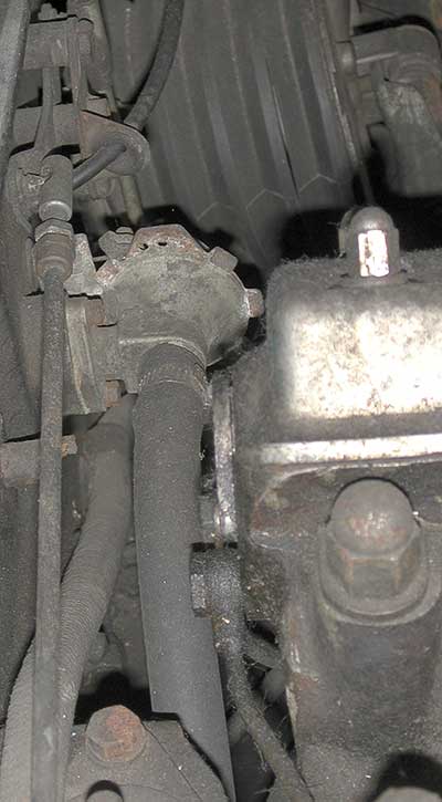 2656-water-out-behind-engine-under-throttle-linkage.jpg